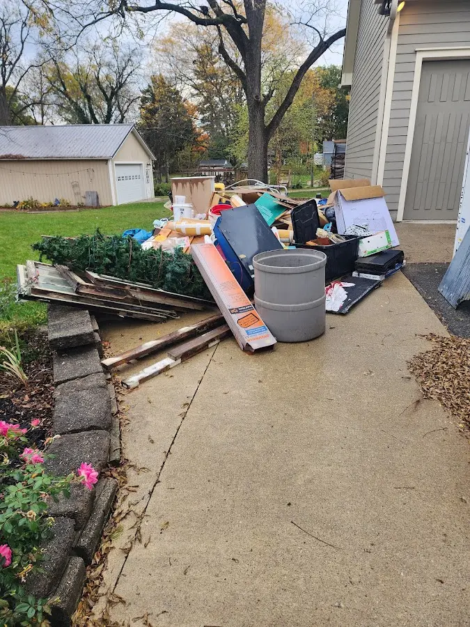 Dumpster being loaded with debris for Demolition Dumpster Rental in Statham